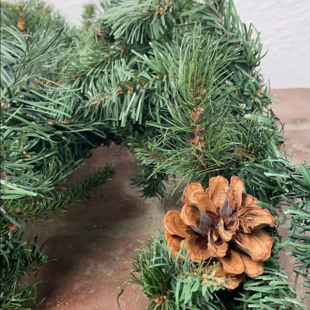 Lifelike synthetic Christmas holiday garland with pine cones 100” long